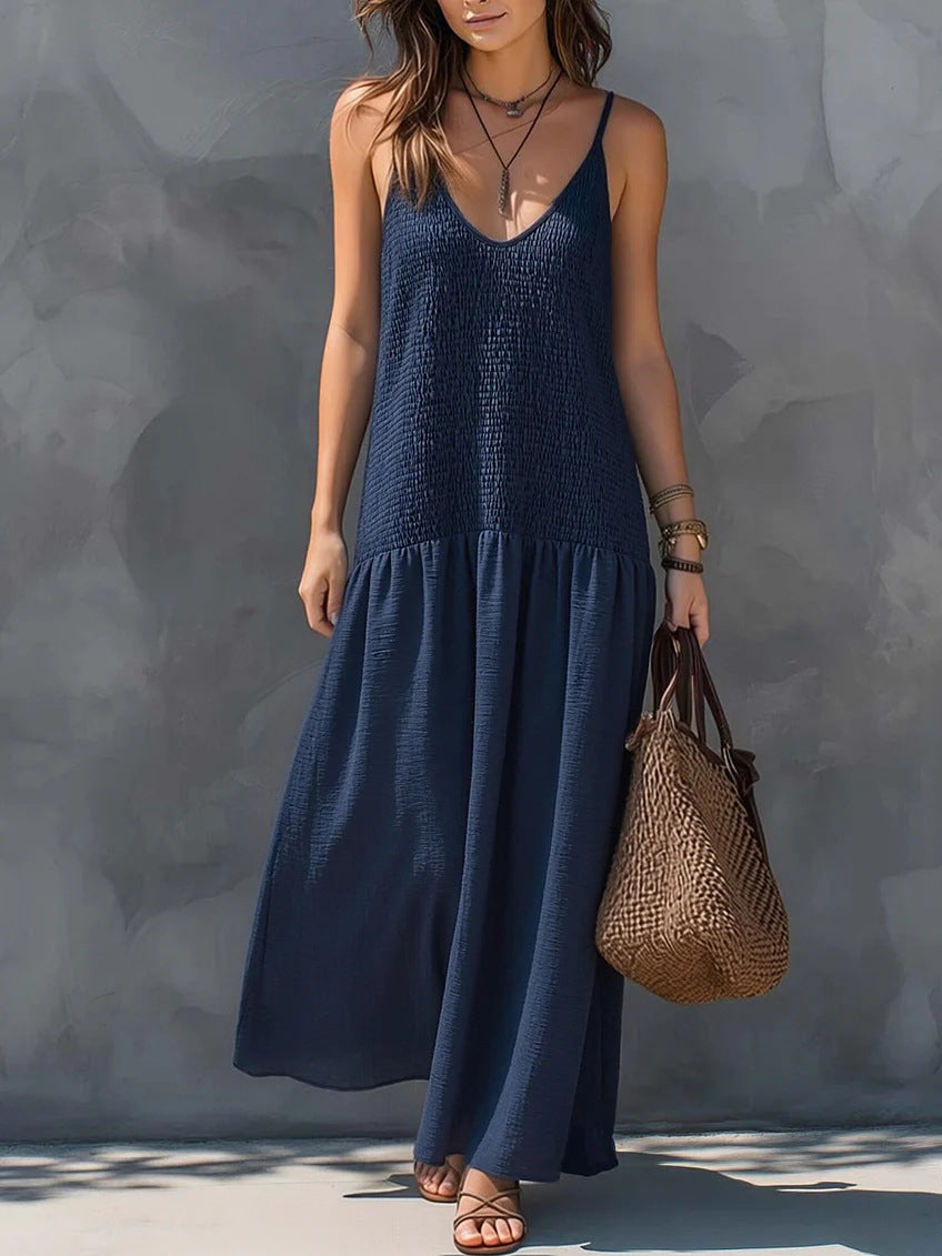 Navy blue tiered maxi sundress with V-neck spaghetti straps and airy skirt
