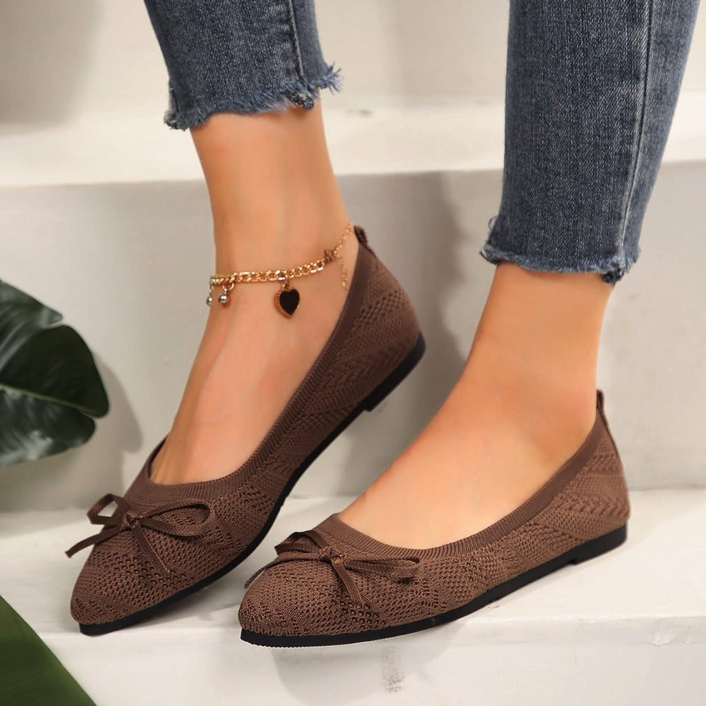 Brown knit pointed-toe loafers with bow and gold beaded ankle chain
