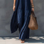 Navy blue tiered maxi sundress with V-neck spaghetti straps and wide hem