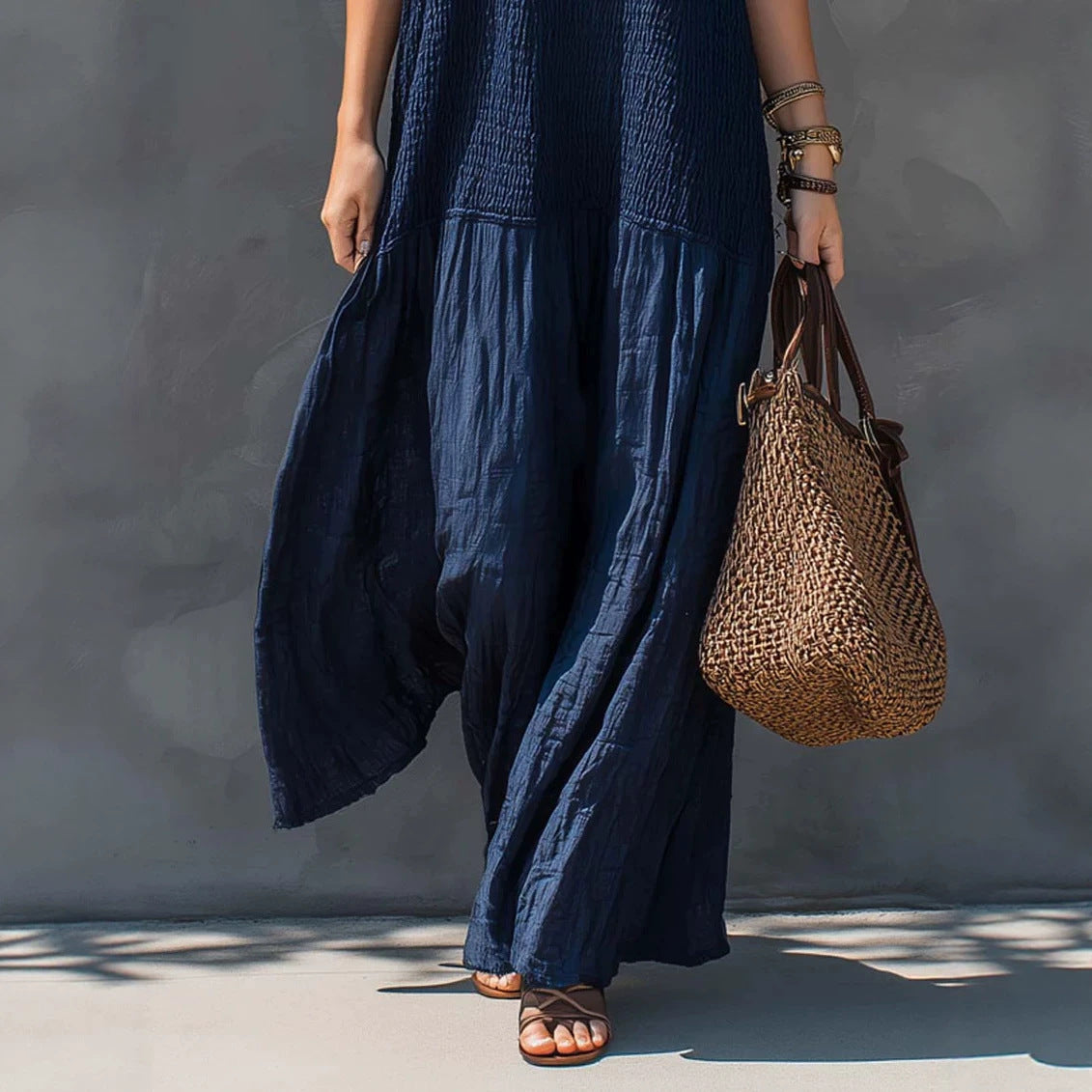 Navy blue tiered maxi sundress with V-neck spaghetti straps and wide hem