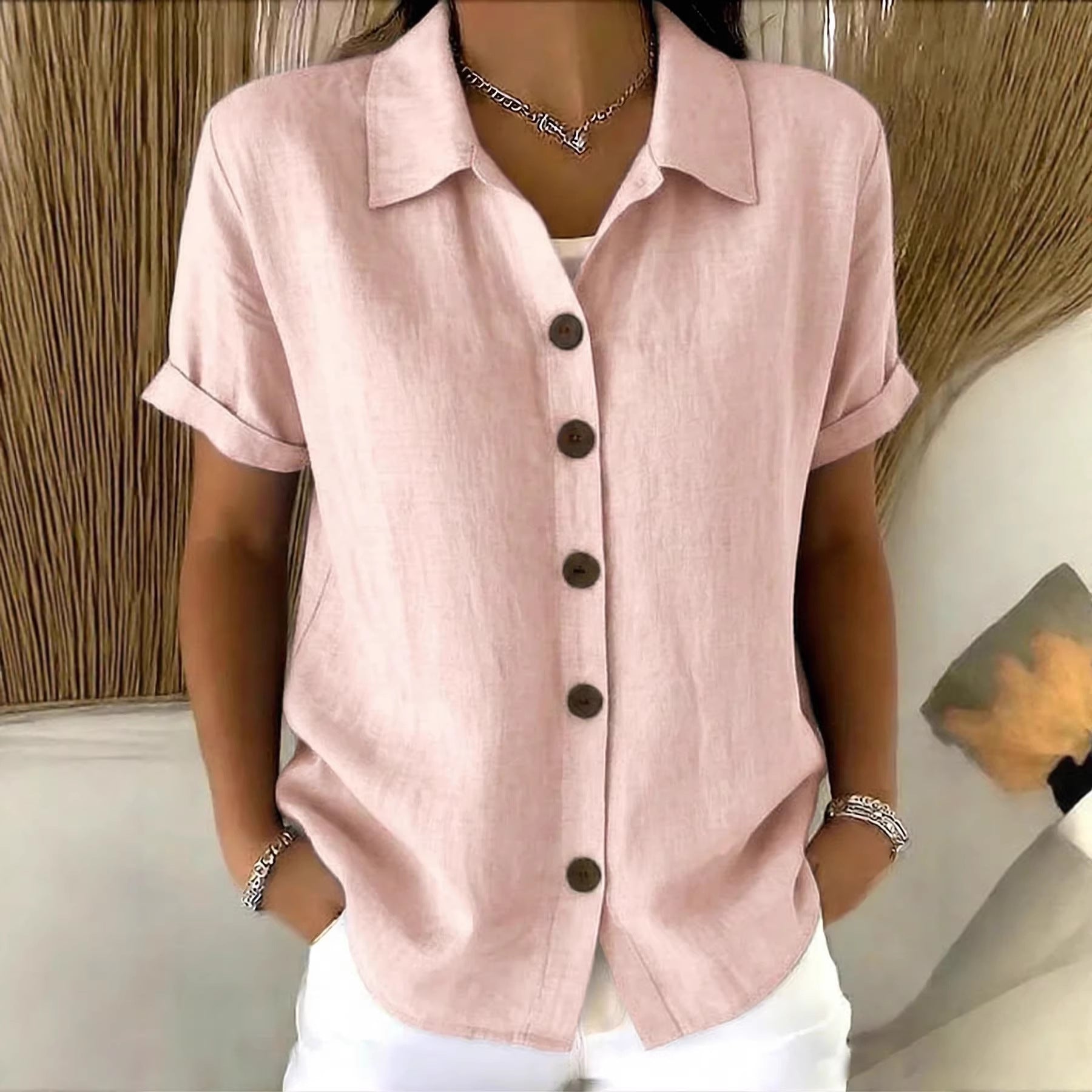 Button-down short-sleeve shirt in light pink with button front and point collar