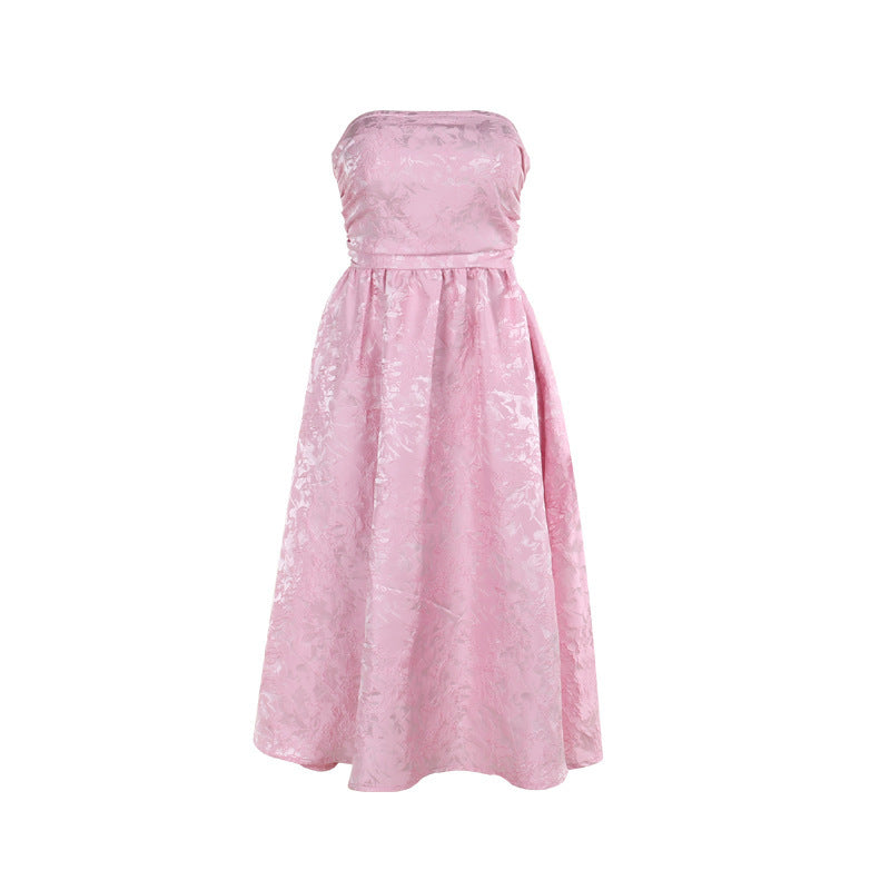 Pink satin jacquard tube top dress with strapless neckline and gathered skirt.