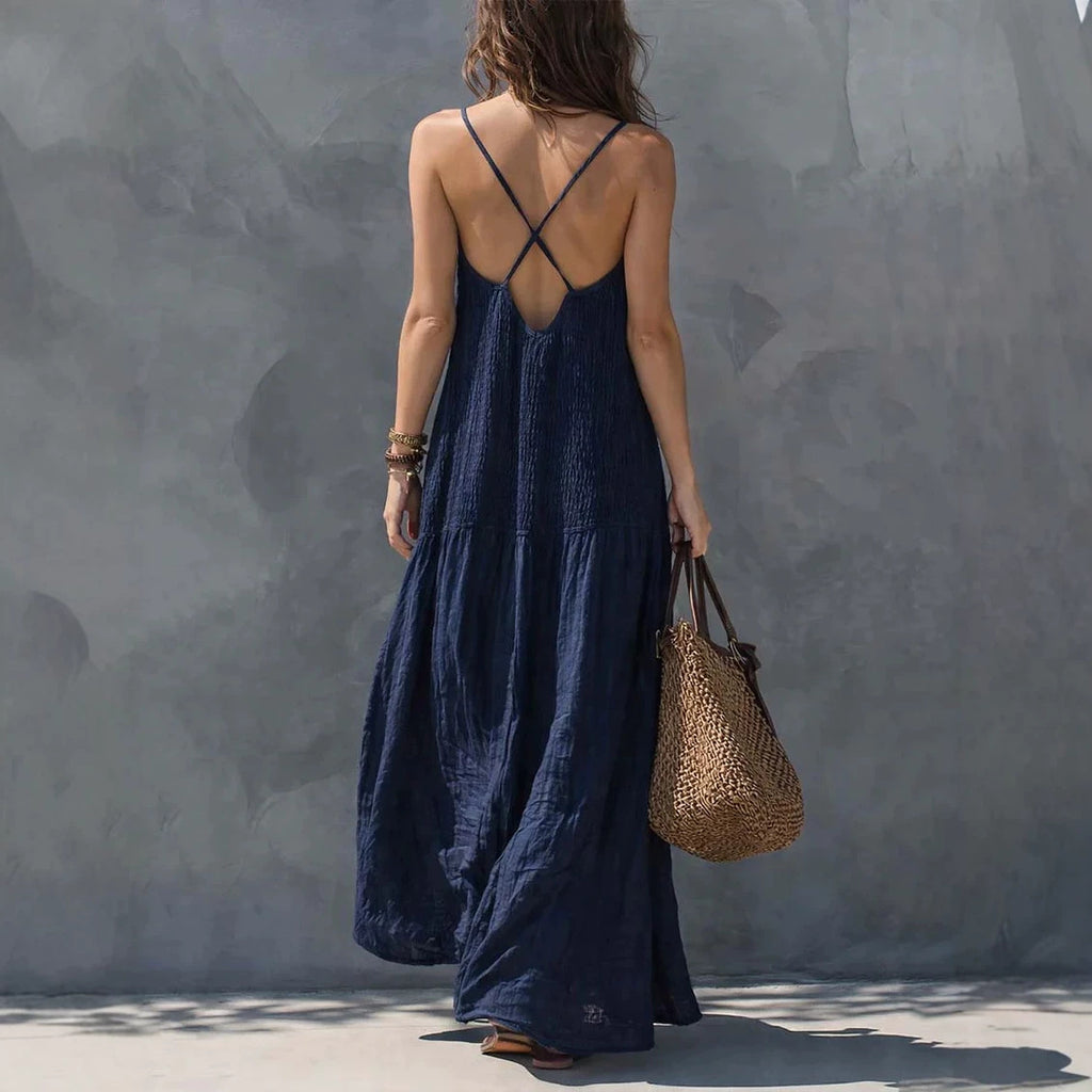 Navy blue maxi dress with crisscross back straps and V-neckline
