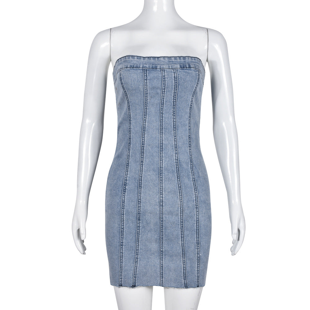 Light blue denim strapless mini dress on mannequin with vertical seam detailing and frayed hem
