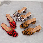 Leopard print heeled sandals set with square toes and block heels in red and tan