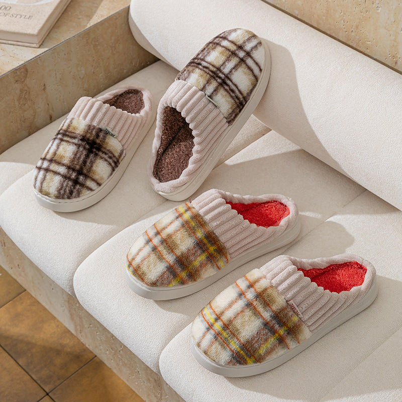 Plaid plush indoor slippers with ribbed cream trim; dark plaid uppers with brown and red linings.