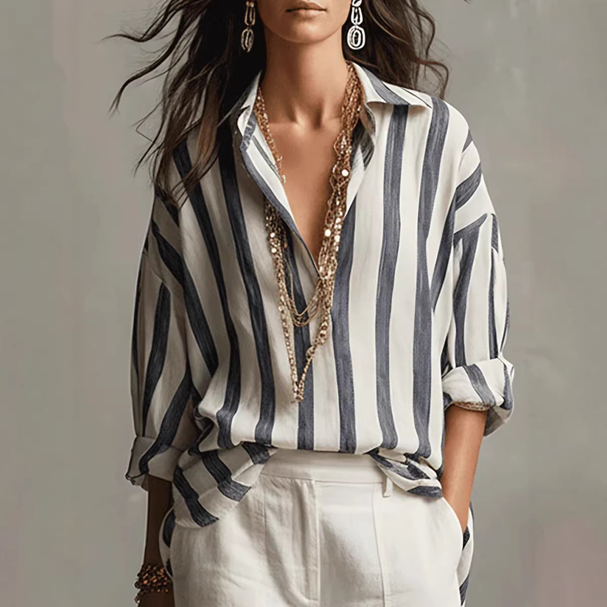 Relaxed-fit collared blouse with vertical striped print, white base and dark blue stripes