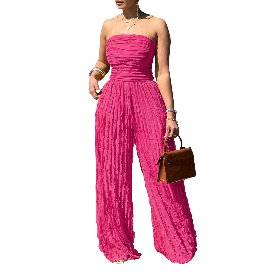 Rose red strapless wide-leg jumpsuit with gathered bodice and textured pleated fabric