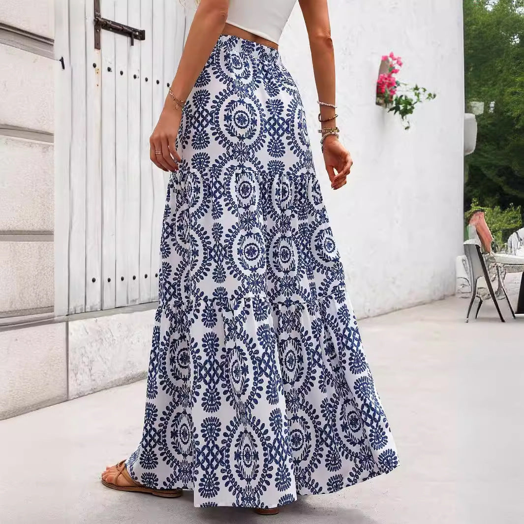 Blue patterned maxi swing skirt with circular swirl motifs and flowing flare