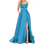 Teal sleeveless maxi dress with square neckline, fitted waist, and front slit