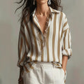 Relaxed-fit collared blouse with vertical striped print, light base and dark brown stripes