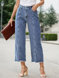 Blue high-waist wide-leg jeans with frayed straight hem, front button and belt loops.