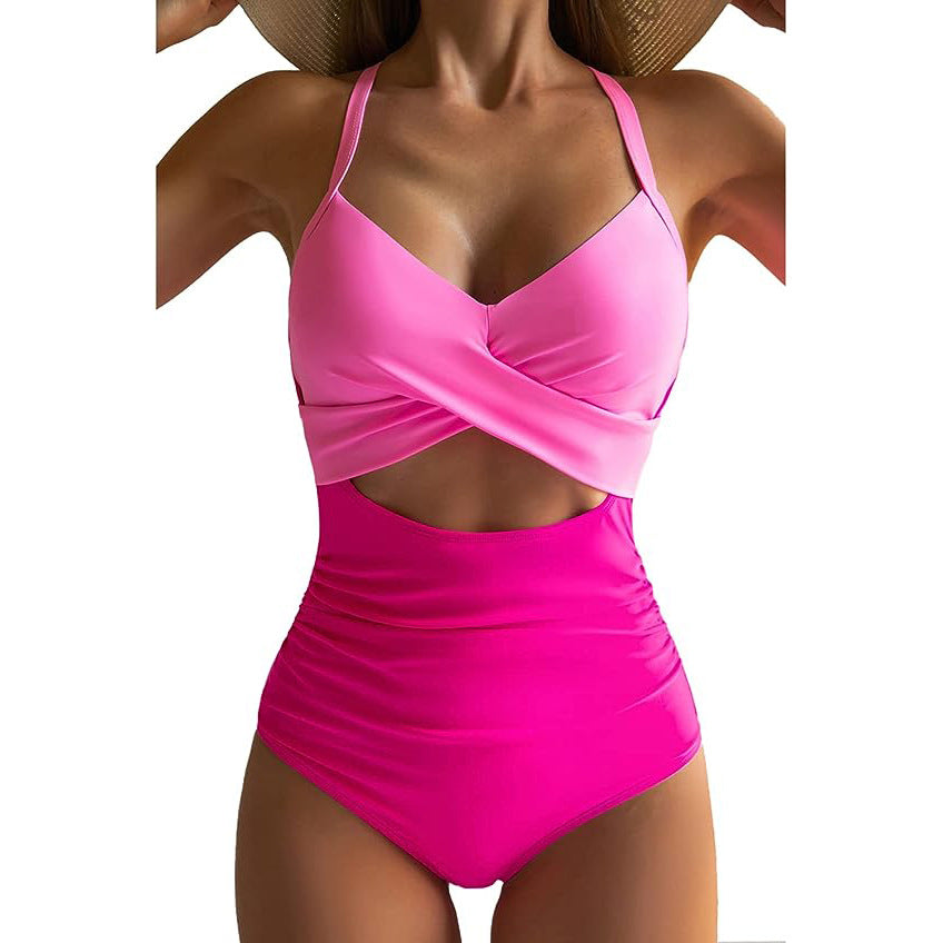 Women's cross one-piece swimsuit in bright pink with midriff cutout
