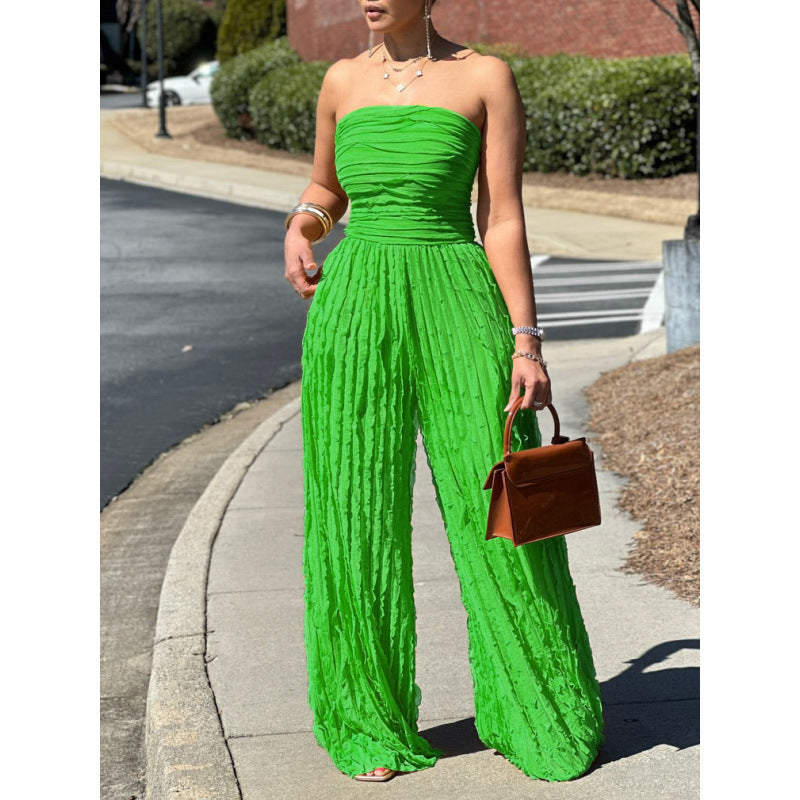 Green strapless wide-leg jumpsuit with gathered bodice and textured pleated fabric