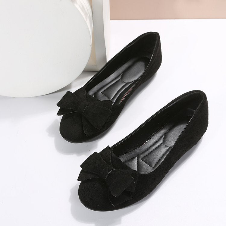 Black suede comfort loafers with fabric bow on toe