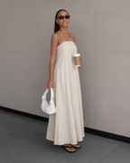 Ivory strapless flowing maxi dress, full-length with gathered bodice and wide skirt