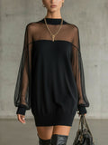 Black knit mini dress with sheer mesh sleeves and ribbed cuffs