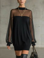 Black knit mini dress with sheer mesh sleeves and ribbed cuffs