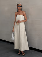 Strapless linen maxi dress in light cream, sleeveless with smooth drape