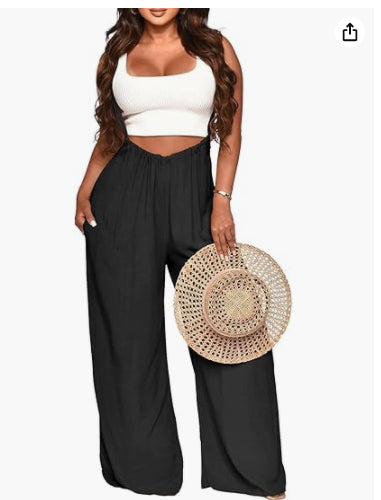 Women's sleeveless jumpsuit with white crop top and wide black flowy pants