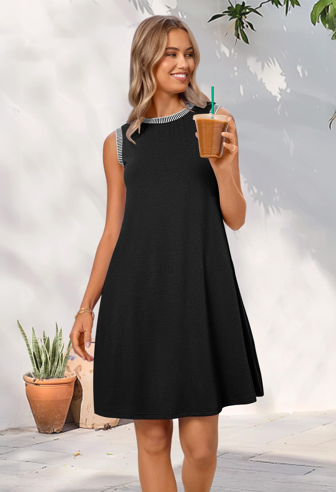 Women's black sleeveless tank dress, crewneck and loose mini flare fit