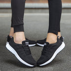 Black knit lace-up sports sneakers with white tread sole