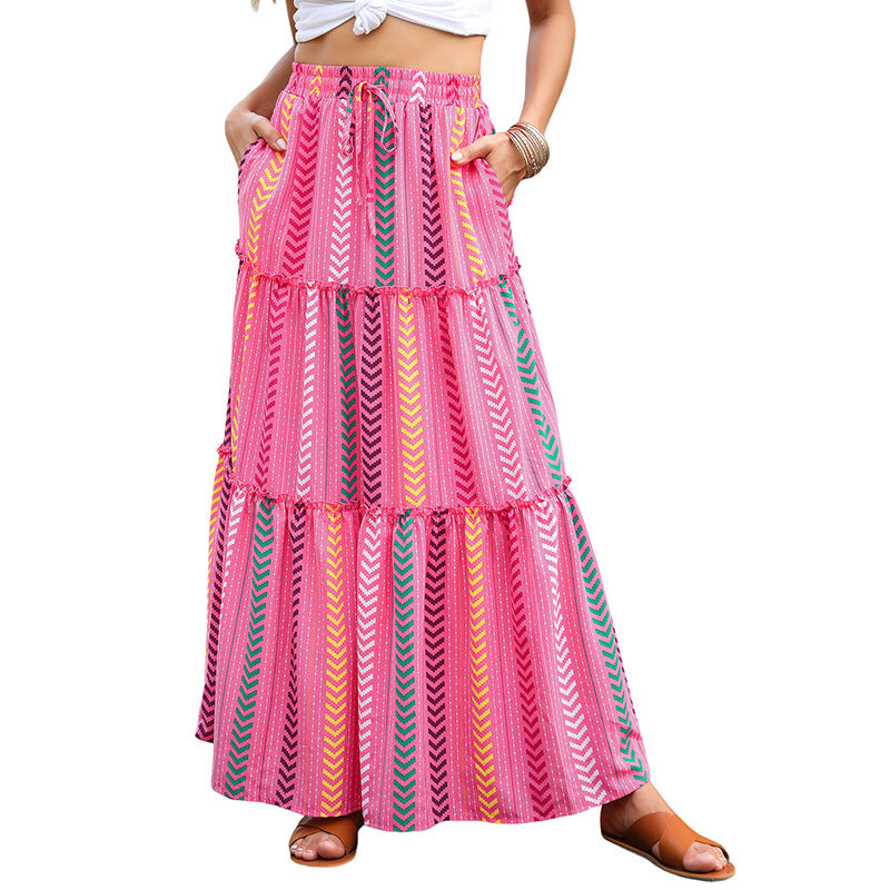 Tiered maxi dress with high waist and striped print in pink, yellow, and teal
