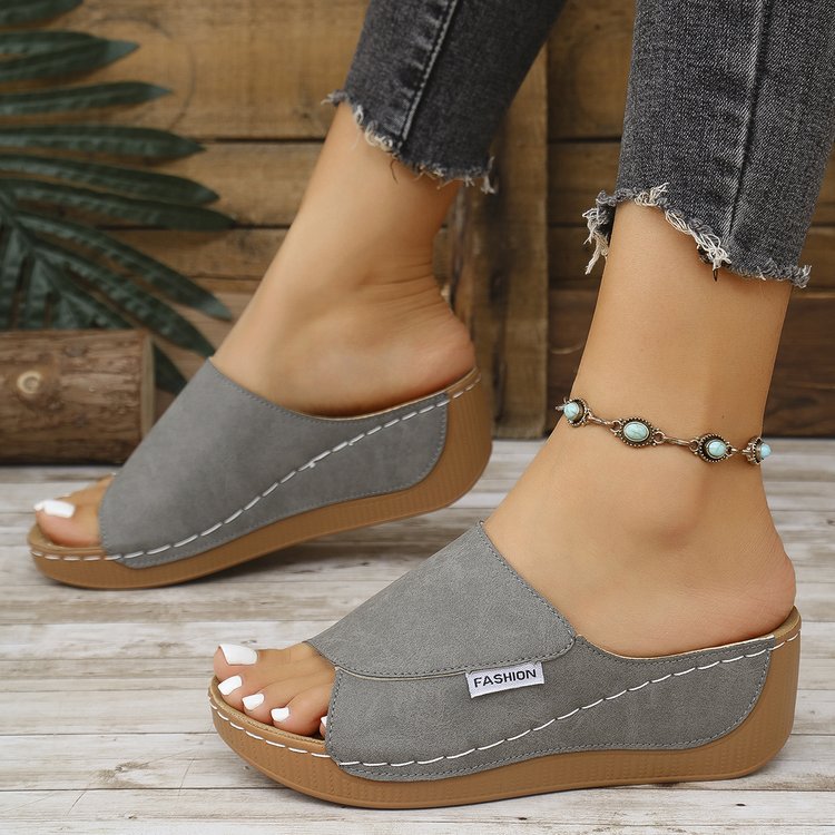Gray wedge slide sandals for women with open toe and stitched trim