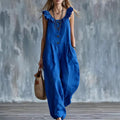 Blue sleeveless button-down jumpsuit with ruffled neckline and front button detail