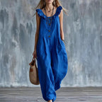 Blue sleeveless button-down jumpsuit with ruffled neckline and front button detail