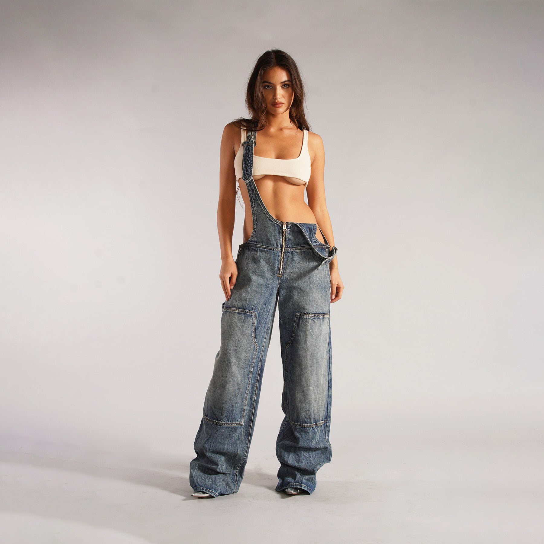 Light blue denim overalls with zip front, loose wide legs, and cargo pockets