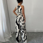 Zebra-print suspender jumpsuit back view, halter straps, tie waist, wide-leg pants
