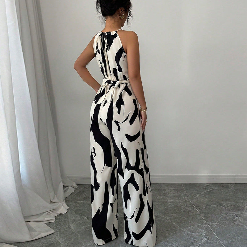 Zebra-print suspender jumpsuit back view, halter straps, tie waist, wide-leg pants