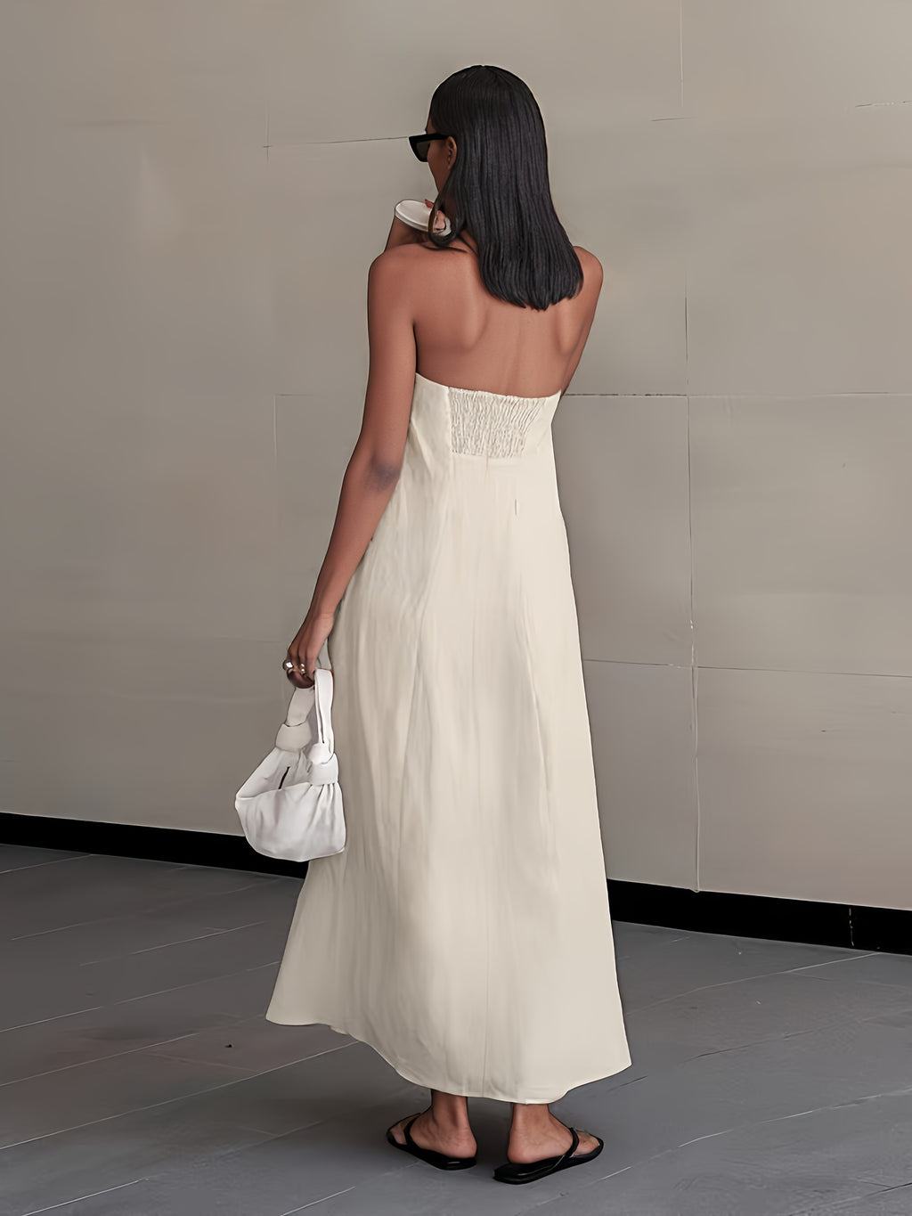 Back view of strapless linen maxi dress in light cream, long length, soft drape