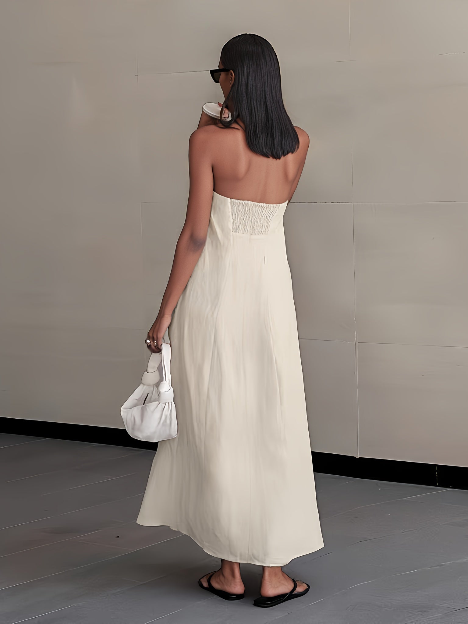Back view of strapless linen maxi dress in light cream, long length, soft drape