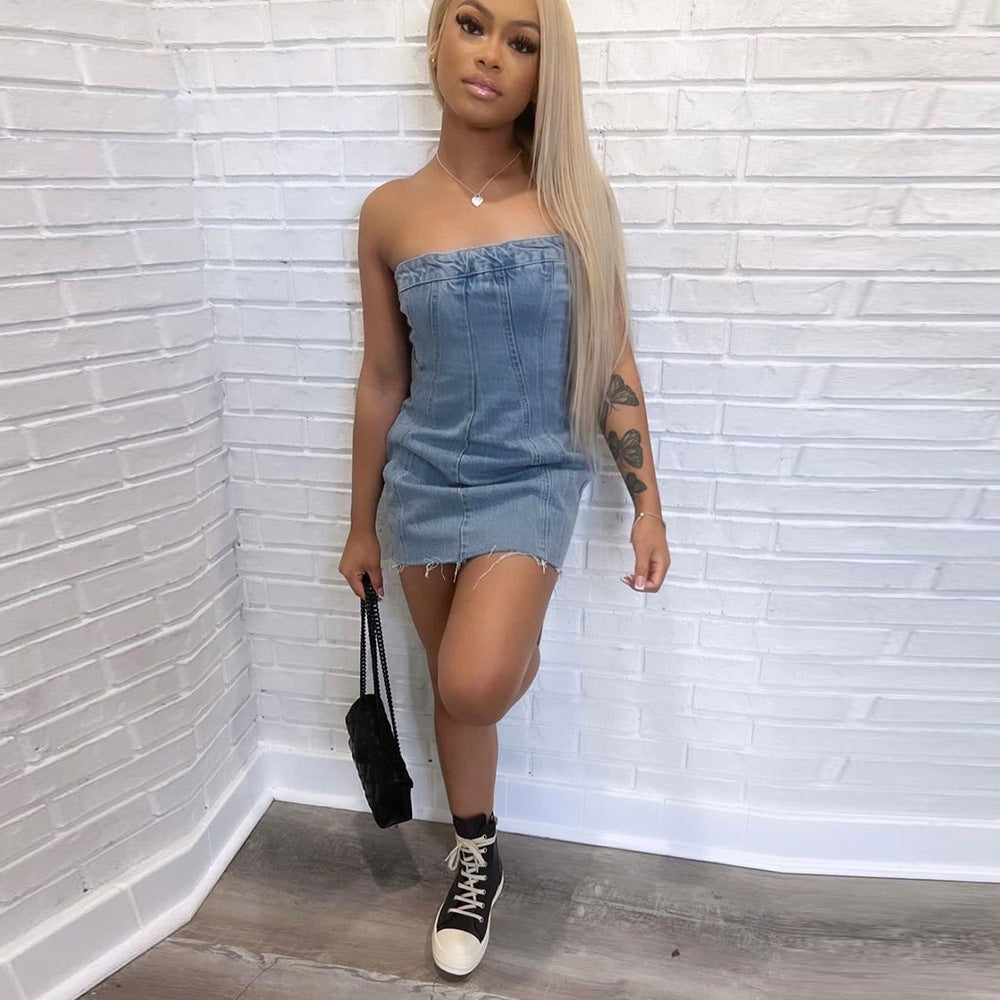 Light blue denim strapless mini dress with frayed hem, fitted shape, and exposed back