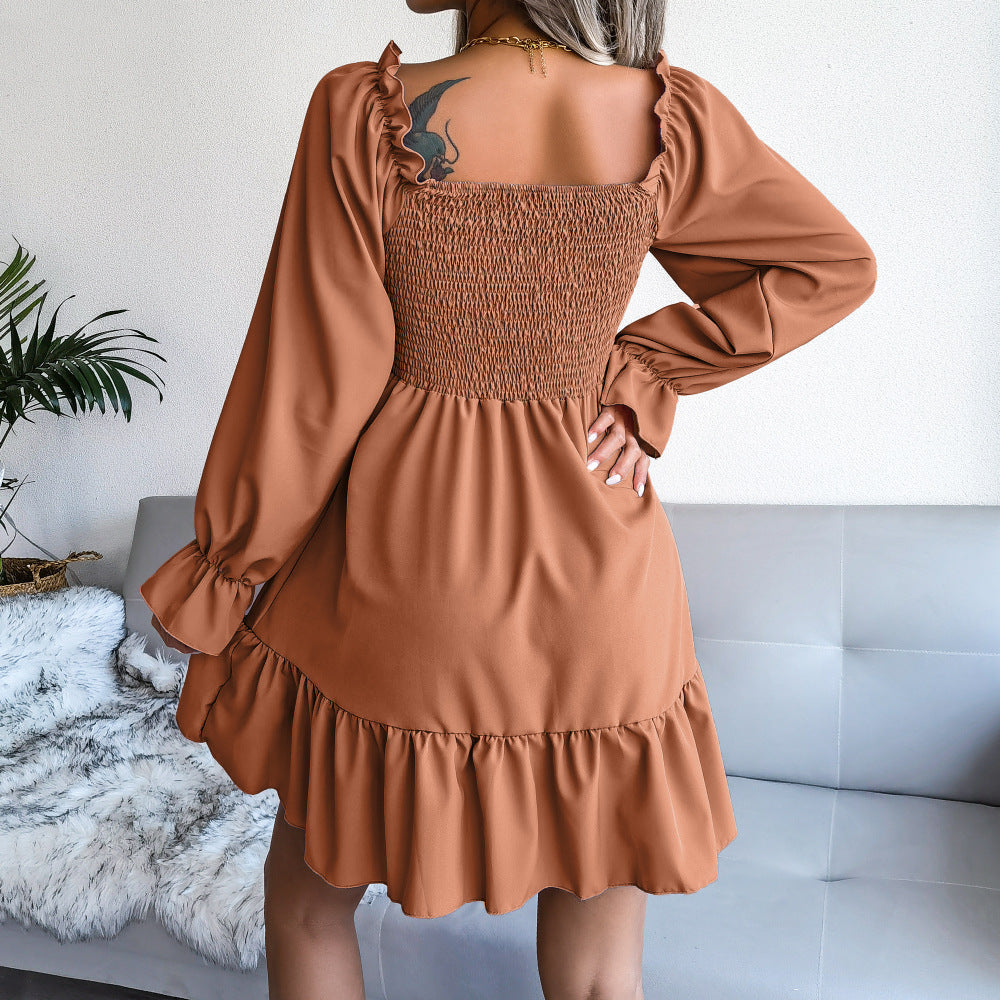 Cinnamon-brown square-neck ruffle swing dress with long puff sleeves and tiered skirt.