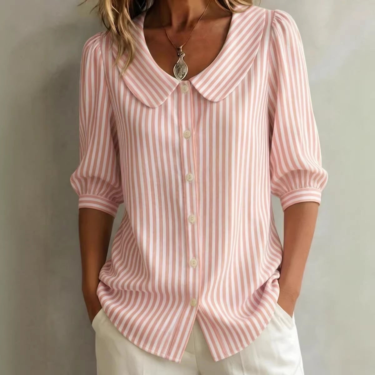 Blush pink-and-white striped V-neck button top with pointed collar and 3/4 sleeves