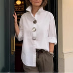 White stand-collar shirt with three metal buttons and 3/4 sleeves