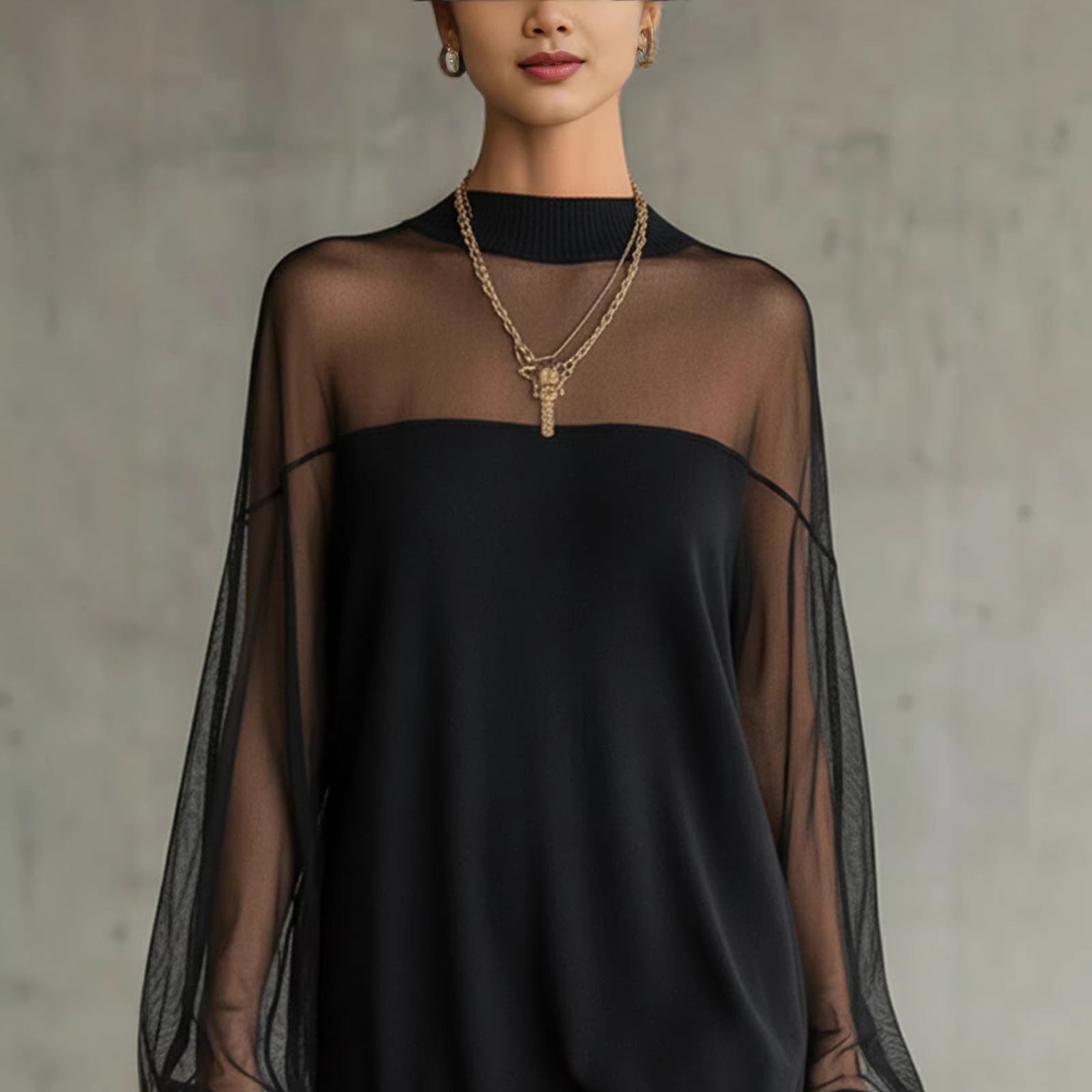 Black mini dress with sheer mesh sleeves and high neckline, ribbed collar