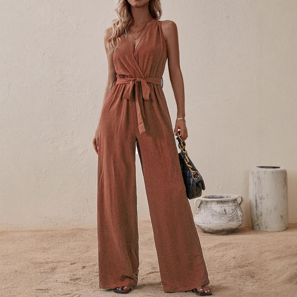 Rust orange high-waist sleeveless jumpsuit with V-neck, tie waist, and wide legs