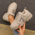 Light beige lace-up chunky-sole sneakers with side logo strap and thick sole