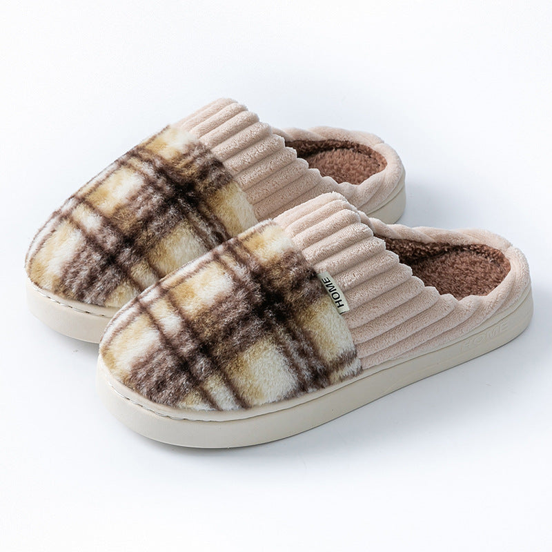Plaid plush indoor slippers with ribbed cream trim; brown and tan plaid uppers with dark lining.