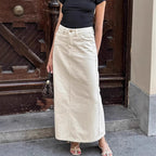 Beige high-waist denim midi skirt with front slit and button-front design