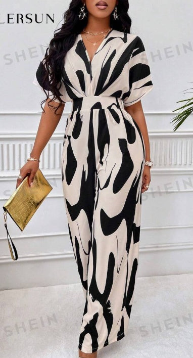 Batwing-sleeve V-neck jumpsuit in black and white abstract print, waist tie