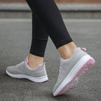 Light grey knit lace-up sports sneakers with pink-striped sole and white tread