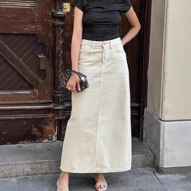 Beige high-waist denim midi skirt with front slit, button closure, and pockets