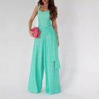 Women’s suspender-style wide-leg pants in teal with spaghetti straps and cargo pockets