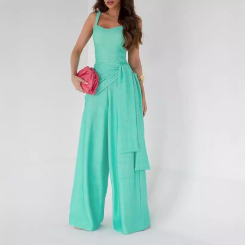 Women’s suspender-style wide-leg pants in teal with spaghetti straps and cargo pockets