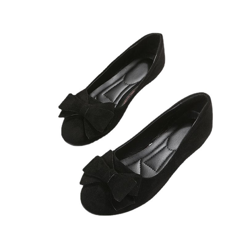 Pair of black suede bow comfort loafers, front view with cushioned lining